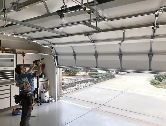 Garage door track repair service by Monroe Garage Door Repair in Monroe